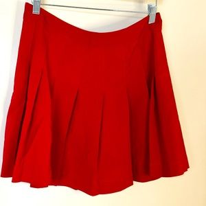 Red mini pleated skirt